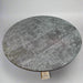 Round stone table on a plain background